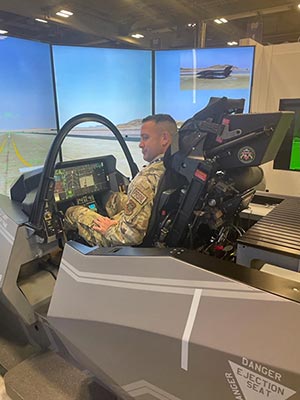 Capt Mike Crouse testing out the F35 simulator during the industry exhibit.