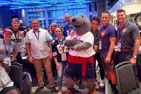 Military Association of New York members catching a photo with the Columbus Clippers mascot during the States Dinner.